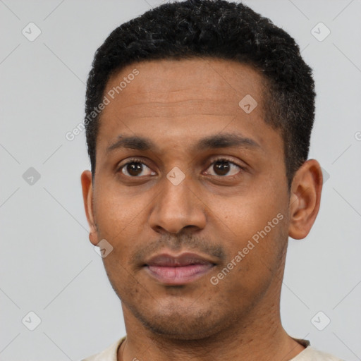 Neutral latino young-adult male with short  black hair and brown eyes