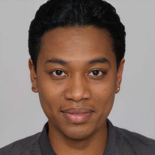 Joyful black young-adult male with short  black hair and brown eyes