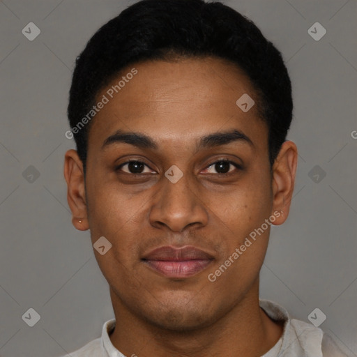 Joyful black young-adult male with short  black hair and brown eyes