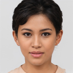 Joyful asian young-adult female with short  brown hair and brown eyes