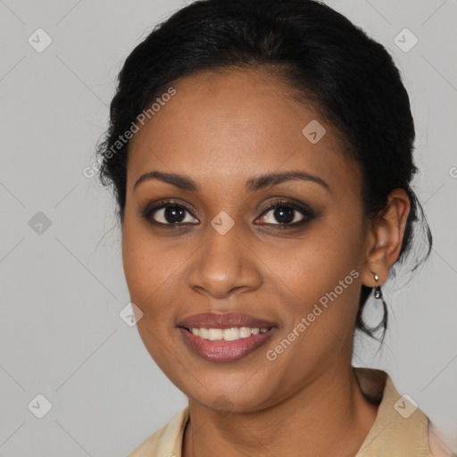 Joyful black young-adult female with medium  black hair and brown eyes