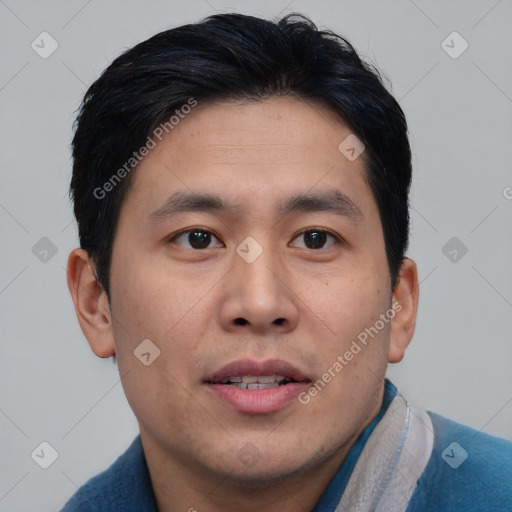 Joyful asian young-adult male with short  brown hair and brown eyes