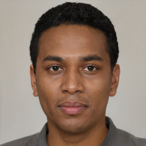 Neutral black young-adult male with short  black hair and brown eyes