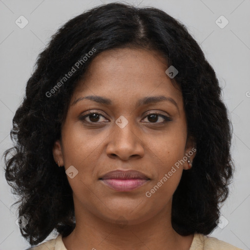 Joyful black young-adult female with long  brown hair and brown eyes