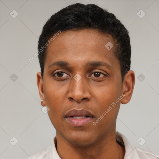 Neutral latino young-adult male with short  black hair and brown eyes