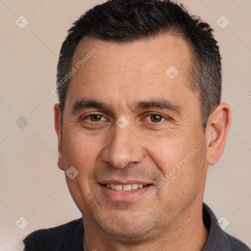 Joyful white adult male with short  brown hair and brown eyes