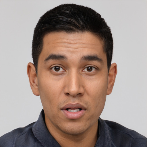Neutral latino young-adult male with short  black hair and brown eyes