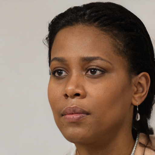 Neutral black young-adult female with short  black hair and brown eyes