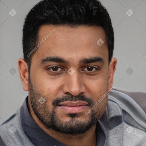 Joyful black young-adult male with short  black hair and brown eyes