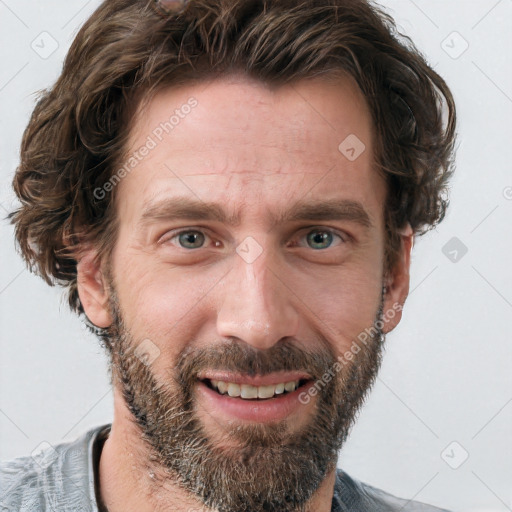 Joyful white adult male with short  brown hair and grey eyes