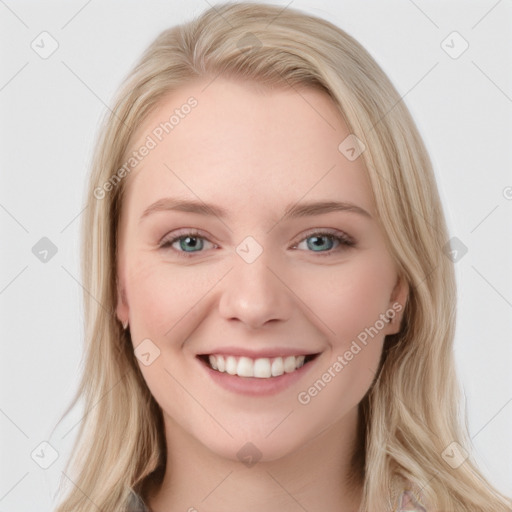 Joyful white young-adult female with long  brown hair and blue eyes