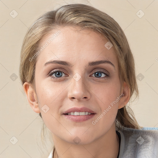 Joyful white young-adult female with medium  brown hair and blue eyes