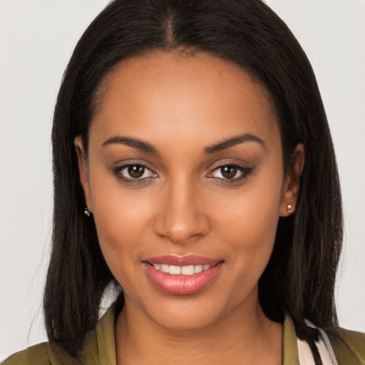 Joyful latino young-adult female with long  brown hair and brown eyes