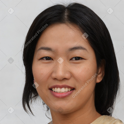 Joyful asian young-adult female with medium  black hair and brown eyes