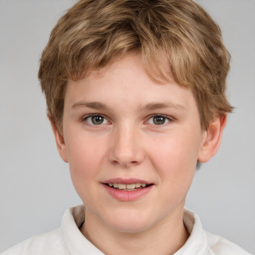 Joyful white child male with short  brown hair and grey eyes