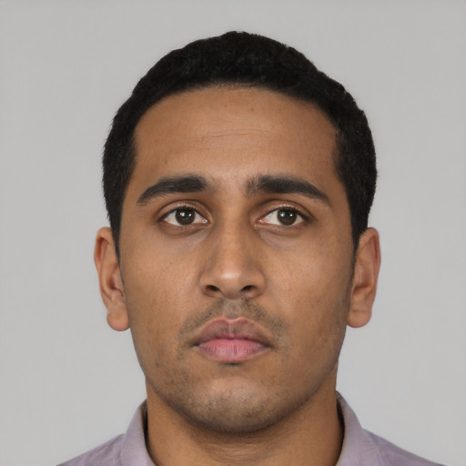 Neutral latino young-adult male with short  black hair and brown eyes