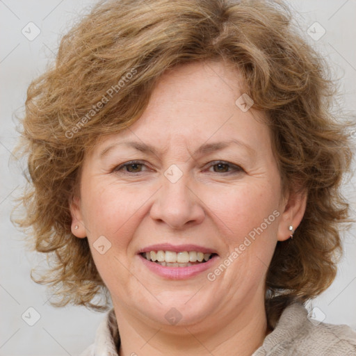 Joyful white adult female with medium  brown hair and blue eyes