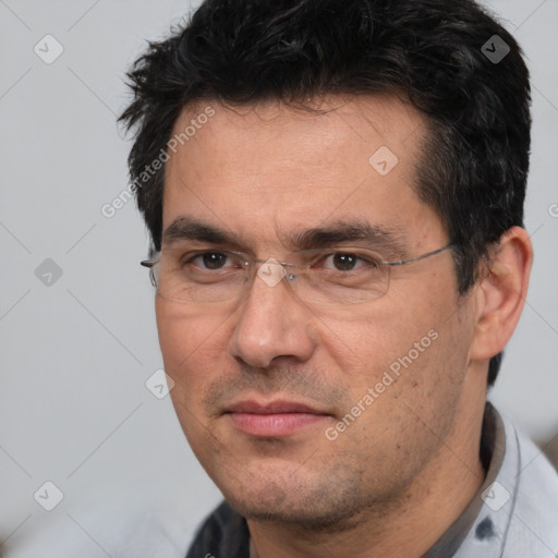 Joyful white adult male with short  black hair and brown eyes