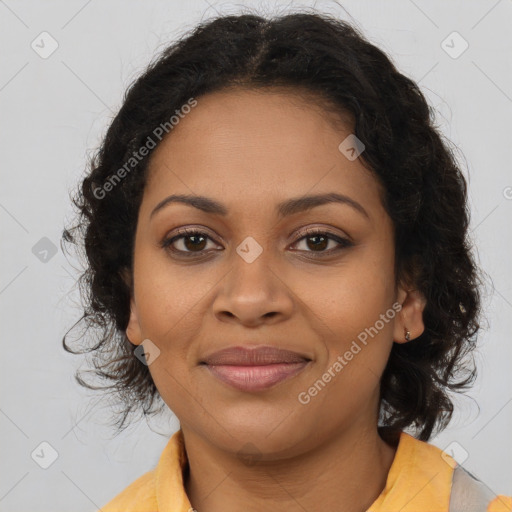 Joyful black young-adult female with long  brown hair and brown eyes