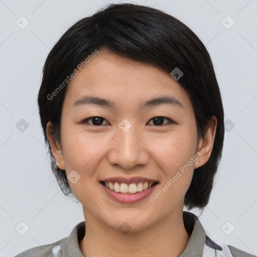 Joyful asian young-adult female with medium  black hair and brown eyes