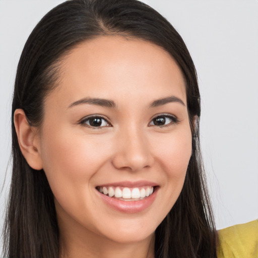 Joyful white young-adult female with long  brown hair and brown eyes