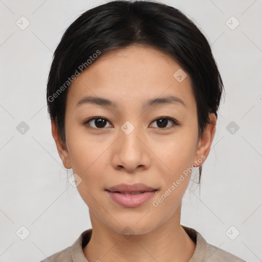 Joyful asian young-adult female with medium  black hair and brown eyes