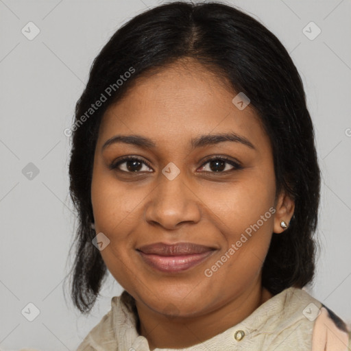 Joyful black adult female with medium  brown hair and brown eyes