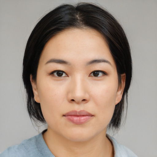 Neutral asian young-adult female with medium  black hair and brown eyes