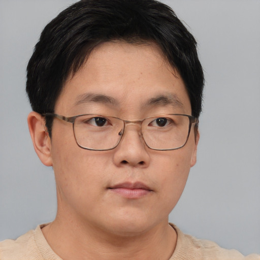 Neutral asian adult male with short  brown hair and brown eyes