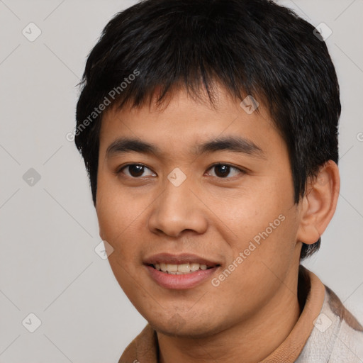 Joyful asian young-adult male with short  black hair and brown eyes