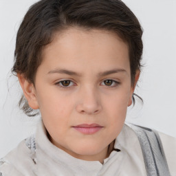 Joyful white child female with short  brown hair and brown eyes