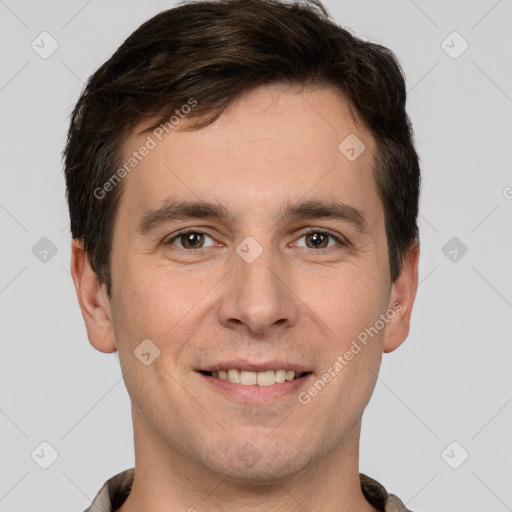 Joyful white young-adult male with short  brown hair and grey eyes