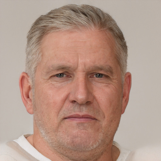 Neutral white middle-aged male with short  gray hair and brown eyes