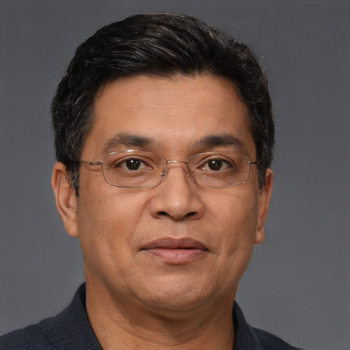 Joyful asian adult male with short  brown hair and brown eyes