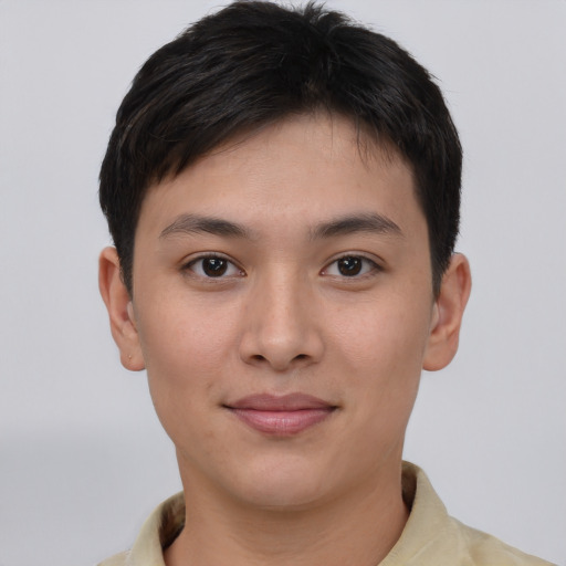 Joyful asian young-adult male with short  brown hair and brown eyes