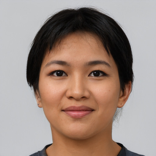 Joyful latino young-adult female with medium  black hair and brown eyes