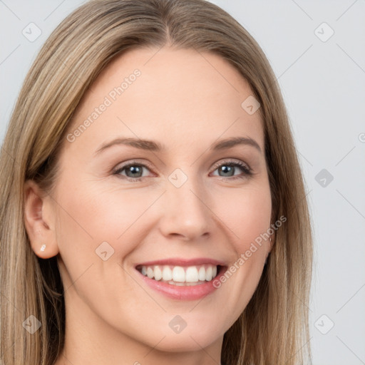 Joyful white young-adult female with long  brown hair and brown eyes