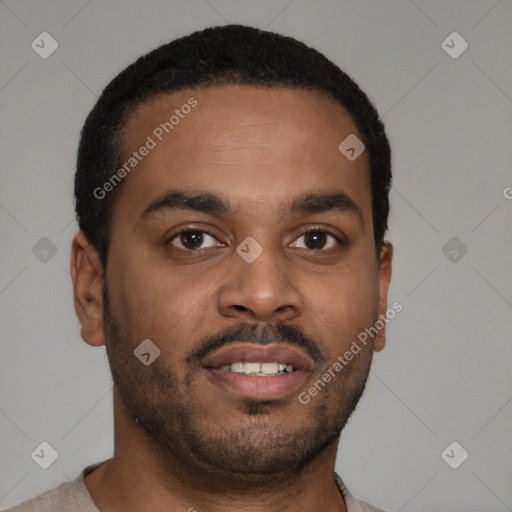 Joyful latino young-adult male with short  brown hair and brown eyes