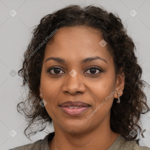 Joyful black young-adult female with medium  brown hair and brown eyes