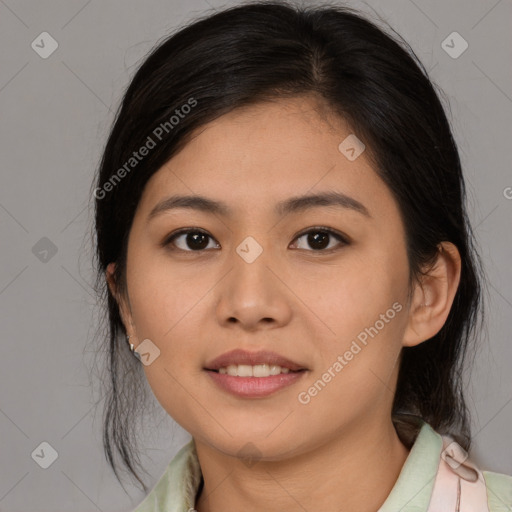 Joyful latino young-adult female with medium  brown hair and brown eyes