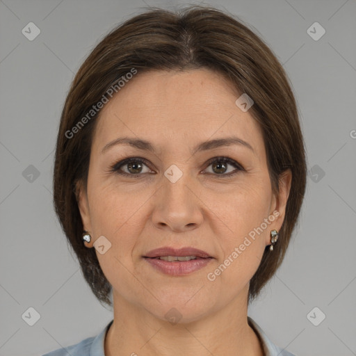 Joyful white adult female with medium  brown hair and brown eyes