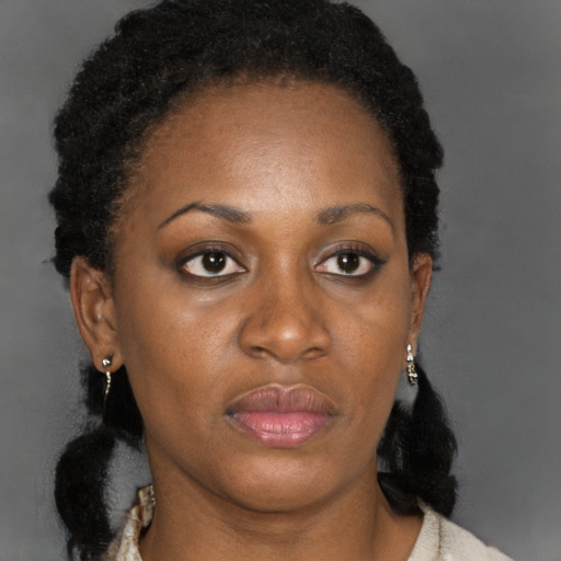 Neutral black adult female with medium  black hair and brown eyes