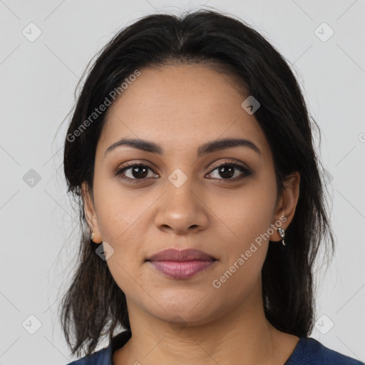 Joyful latino young-adult female with medium  brown hair and brown eyes