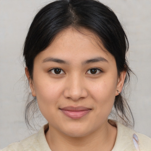 Joyful asian young-adult female with medium  brown hair and brown eyes
