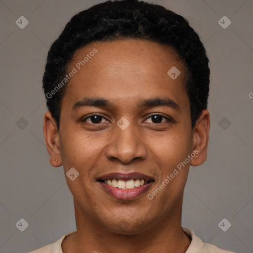 Joyful latino young-adult male with short  black hair and brown eyes