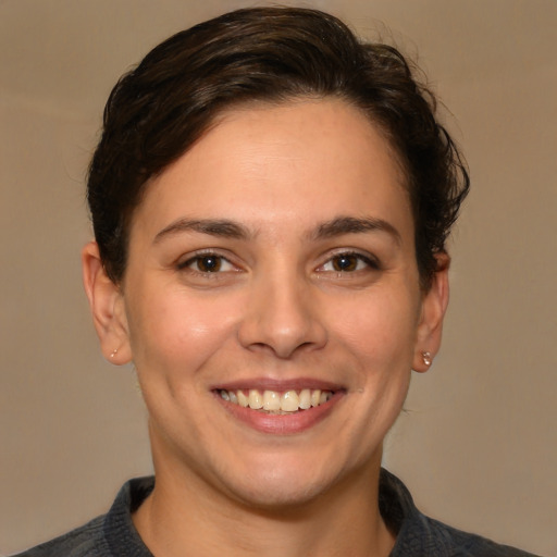 Joyful white young-adult female with medium  brown hair and brown eyes