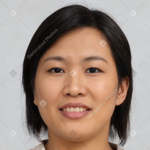 Joyful asian young-adult female with medium  brown hair and brown eyes