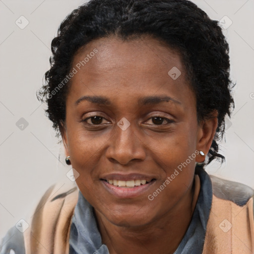 Joyful black adult female with short  brown hair and brown eyes