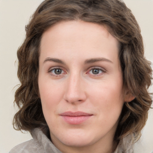 Joyful white young-adult female with medium  brown hair and green eyes