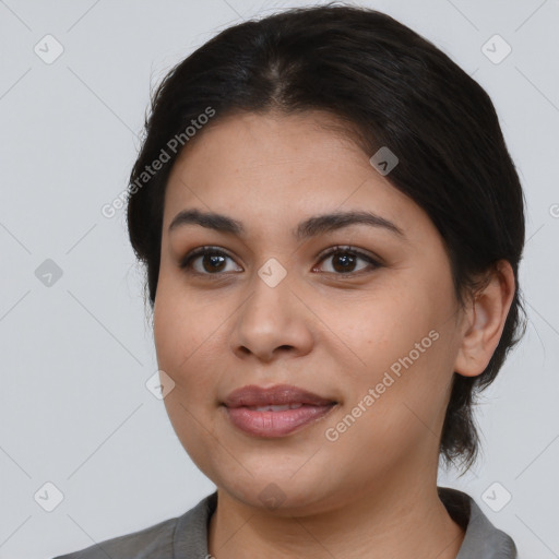 Joyful latino young-adult female with medium  black hair and brown eyes